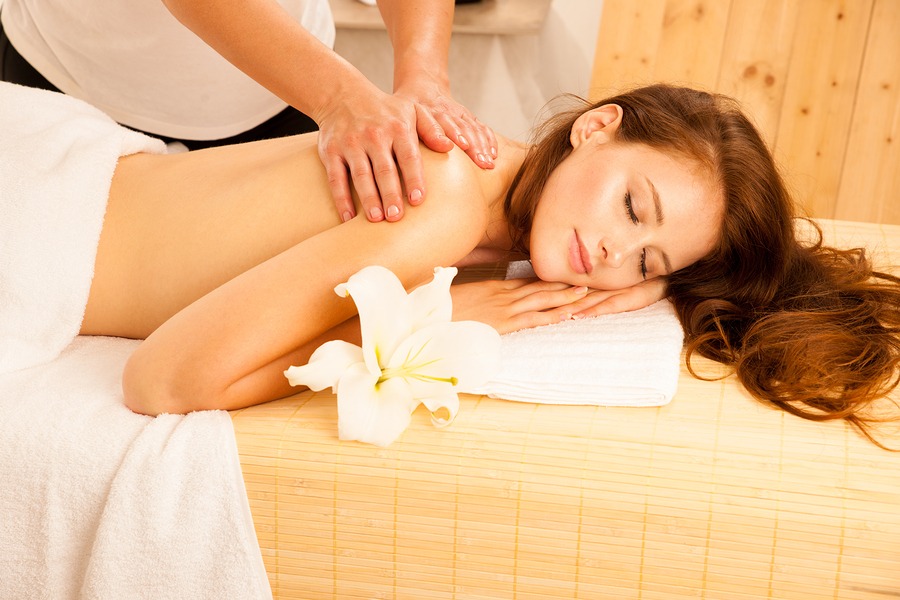 young woman receiving shoulder massage