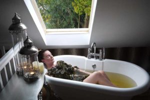 woman wrapped in mineral rich seaweeds