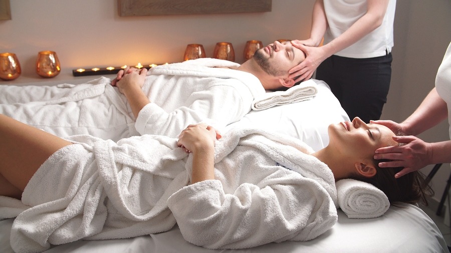 Couple getting massage in spa