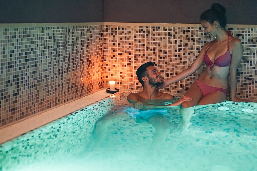 Happy young couple doing a swimming pool spa center day - Our luxury day spa offers a wide range of therapeutic treatments such as massages, facials and body scrub Juvenex Spa in New York, Manhattan NYC