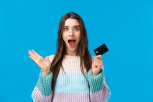Surprised and amazed girl received a gift card of Best cities for New Year's Eve celebration with family 2021 last minute gifts unique gifts card for couples, Spa massage in New York City, Manhattan